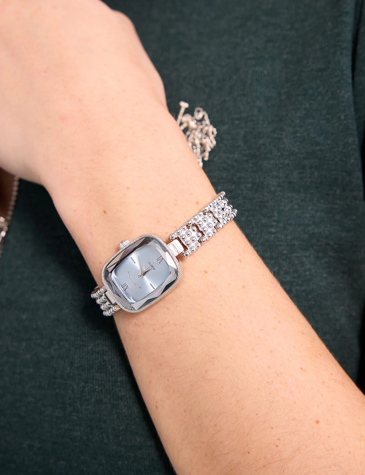 LADIES SILVER OVAL WATCH WITH BLUE FACE
